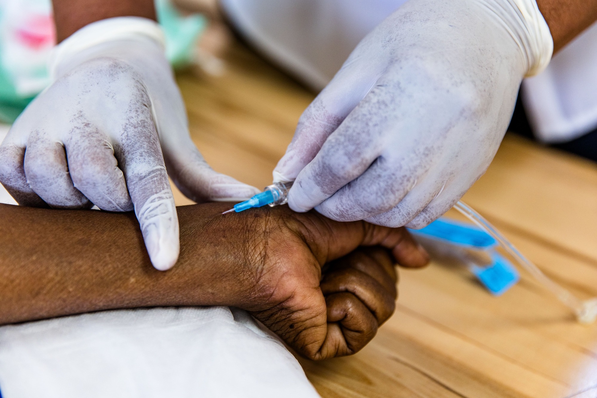 Scientist looking at liquid in container