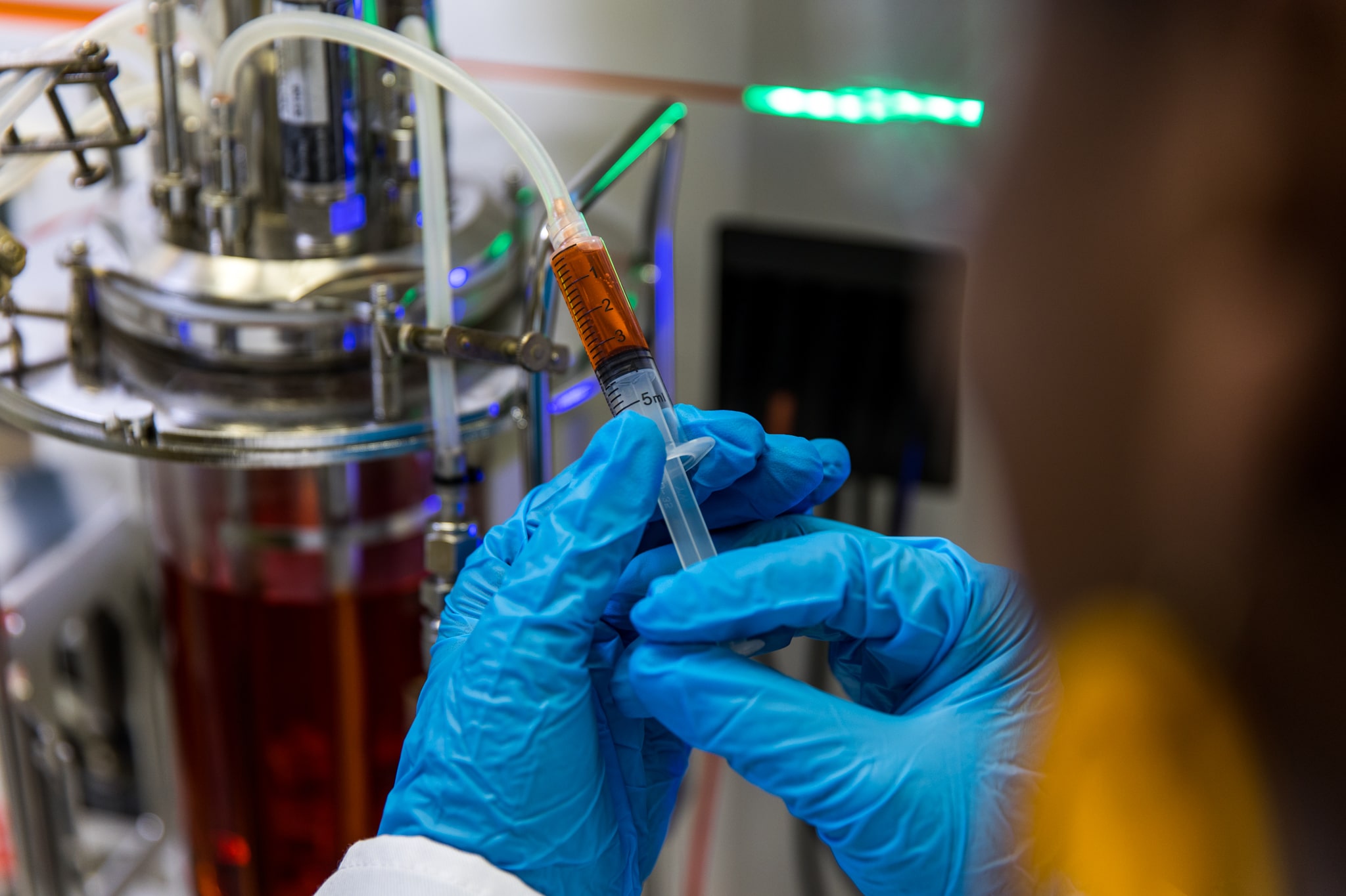 Scientist pushing a syringe