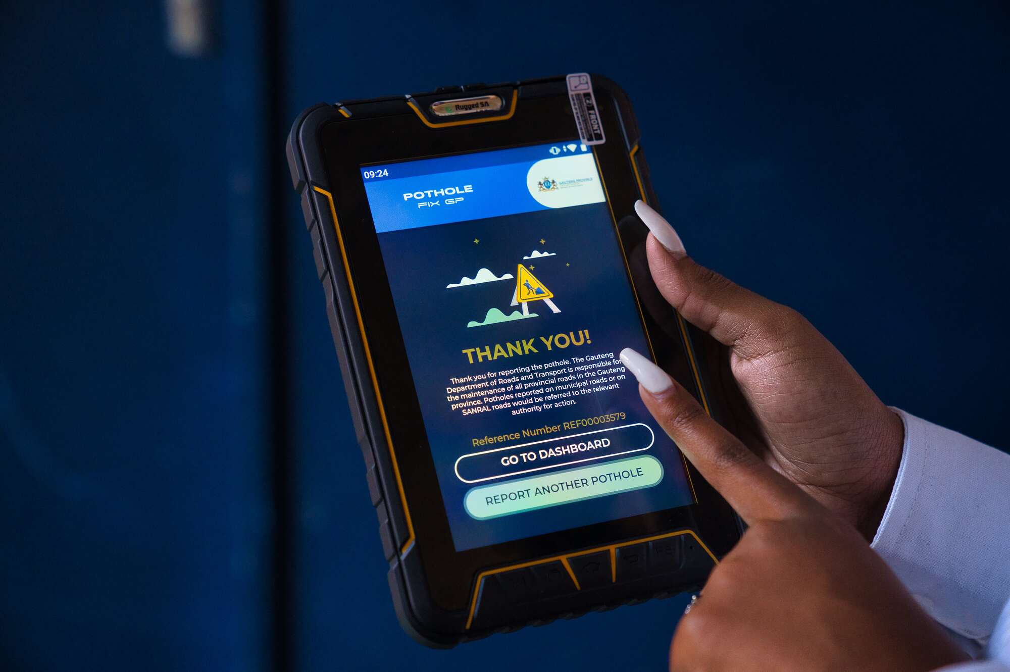 Fingers pointing at tablet screen