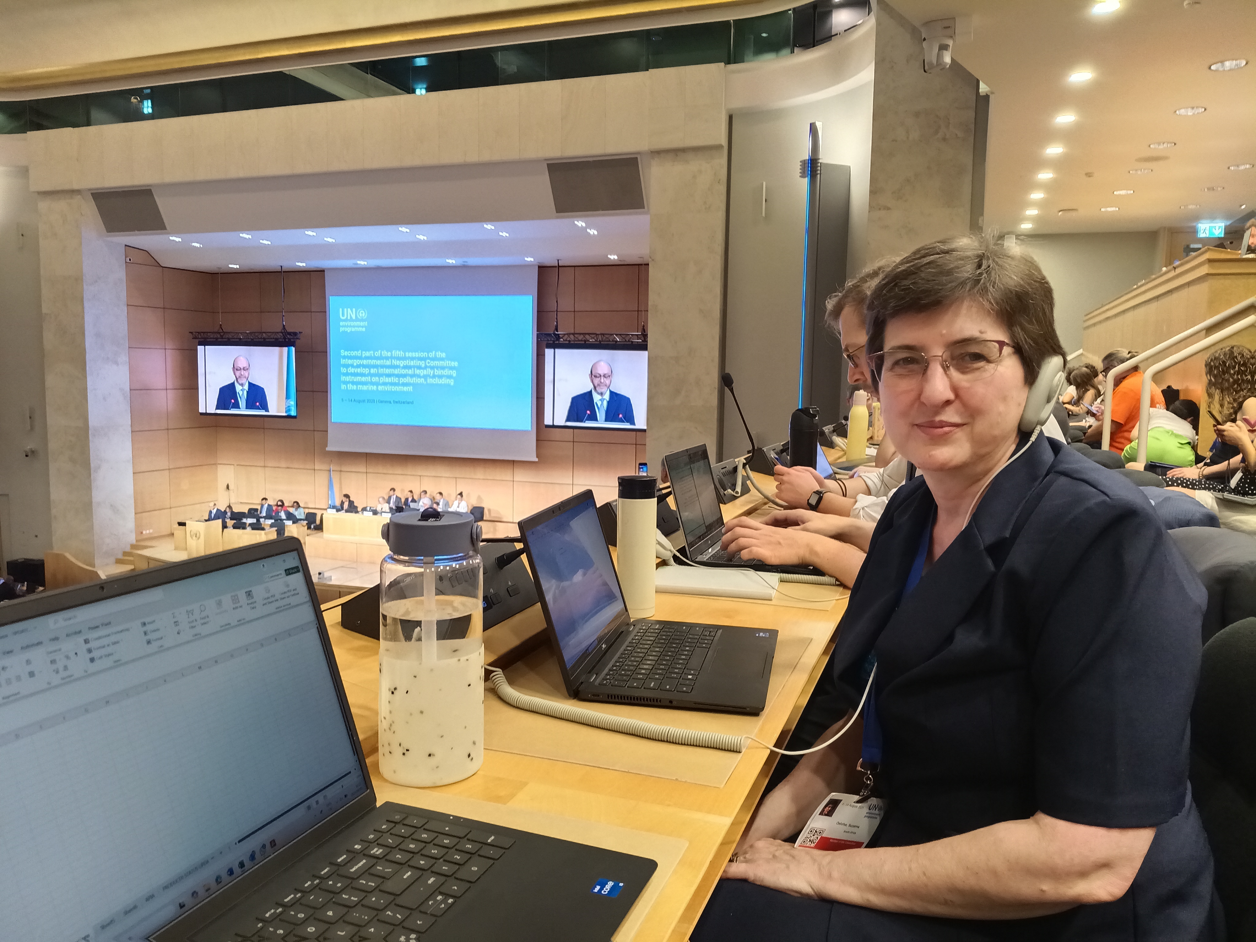 Woman sitting facing a camera