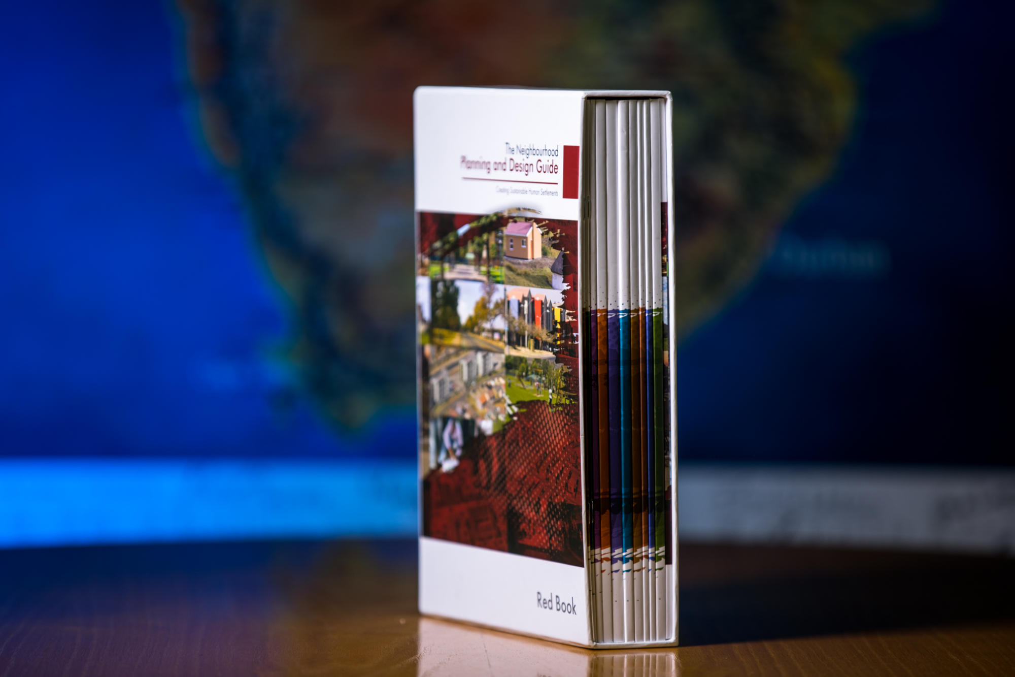 Hand holding a container with yellowish liquid