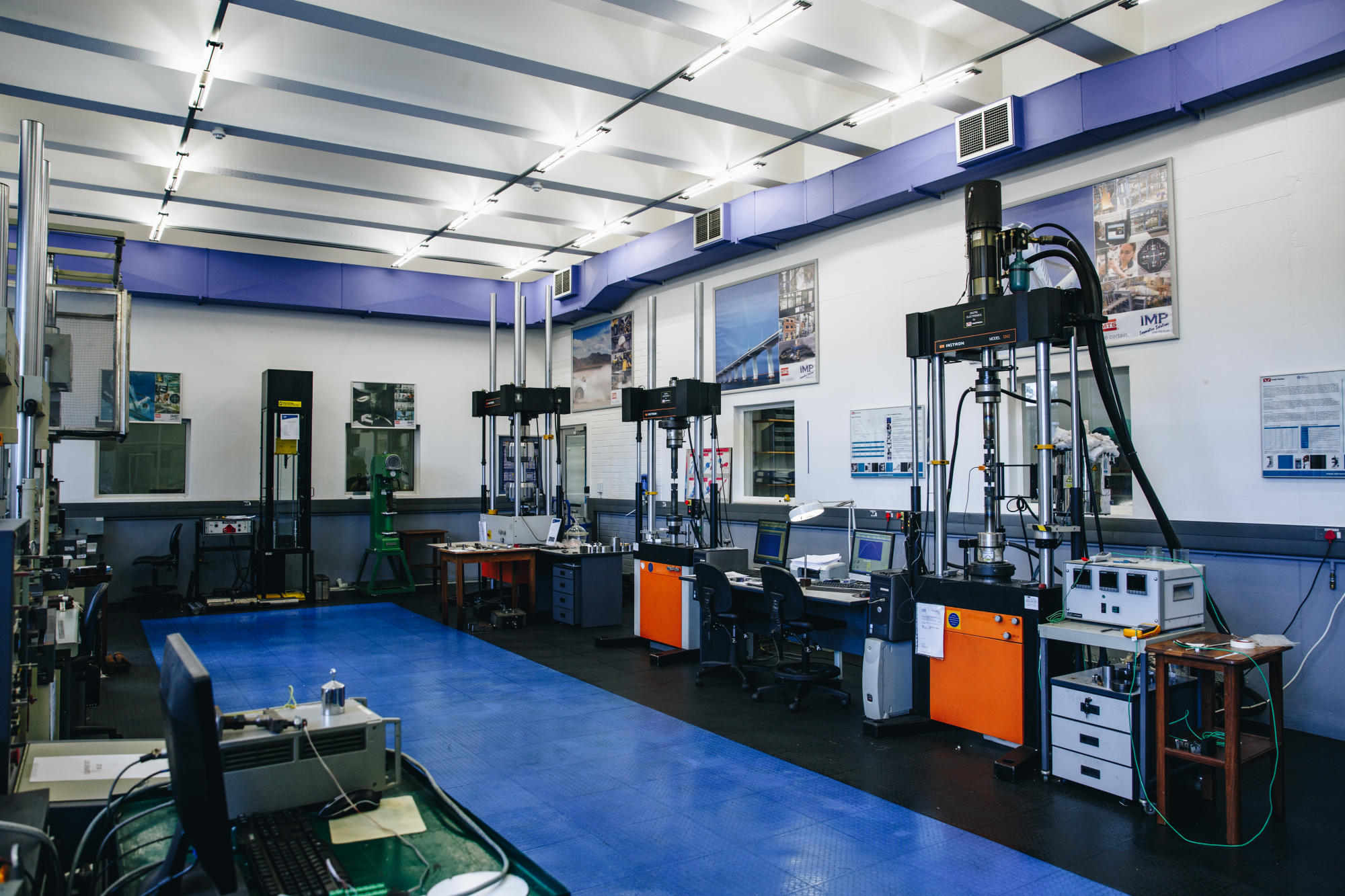 Hand holding a container with yellowish liquid