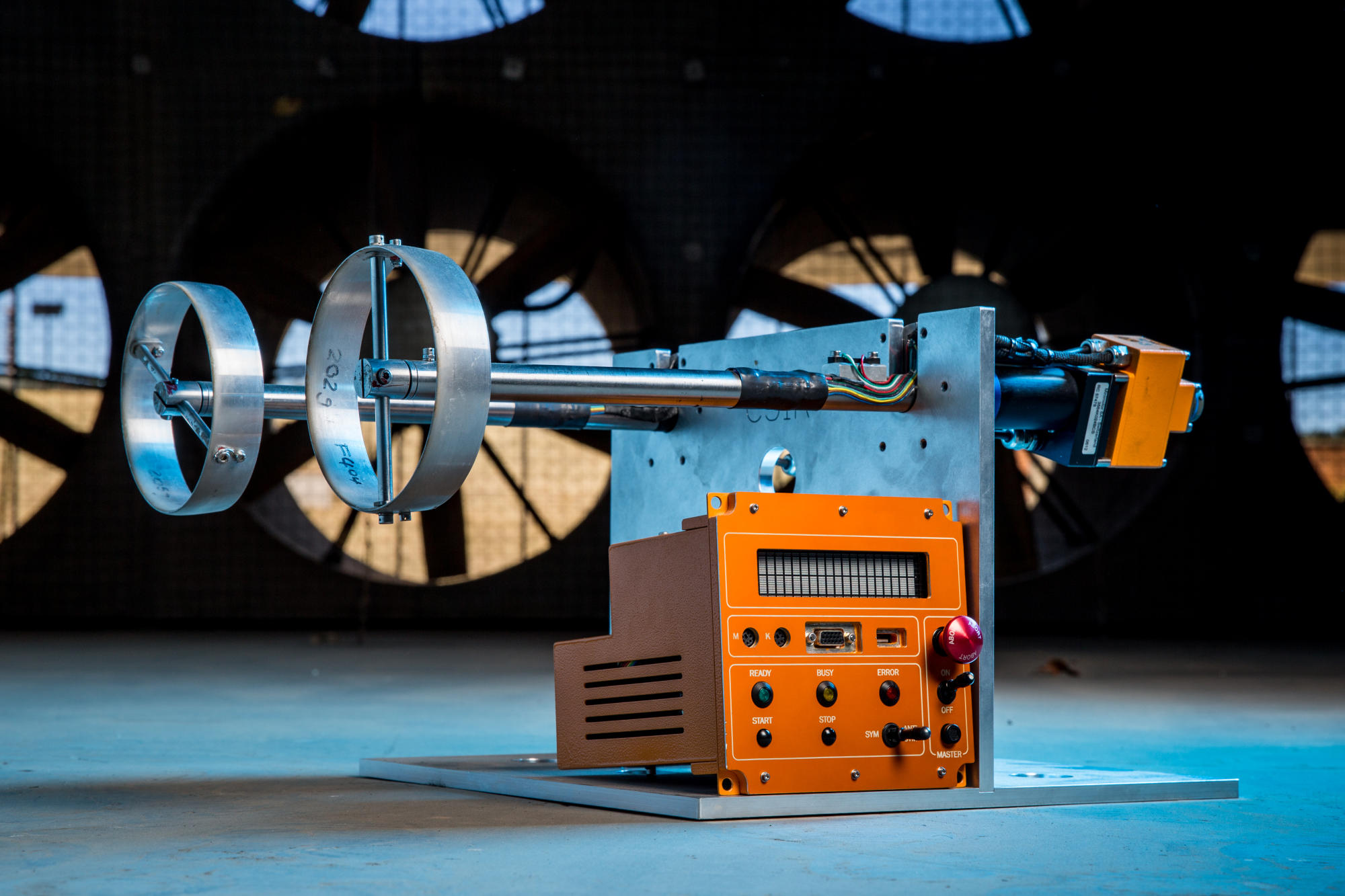 Hand holding a container with yellowish liquid