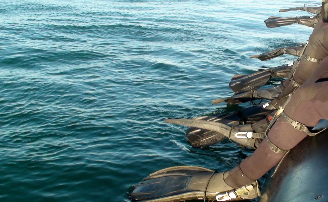 Divers feet near water
