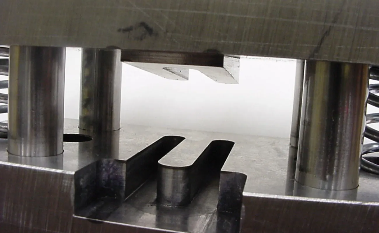 Hand holding a container with yellowish liquid