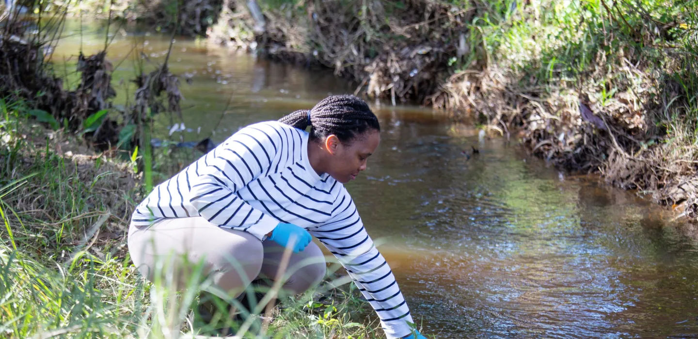 person getting river water