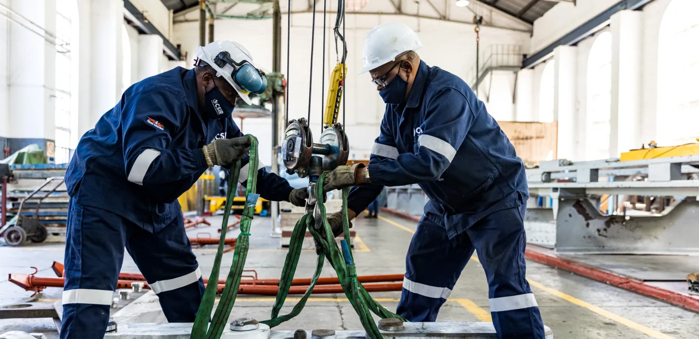 two men working on equipment