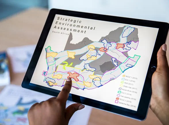 Finger pressed against an iPad